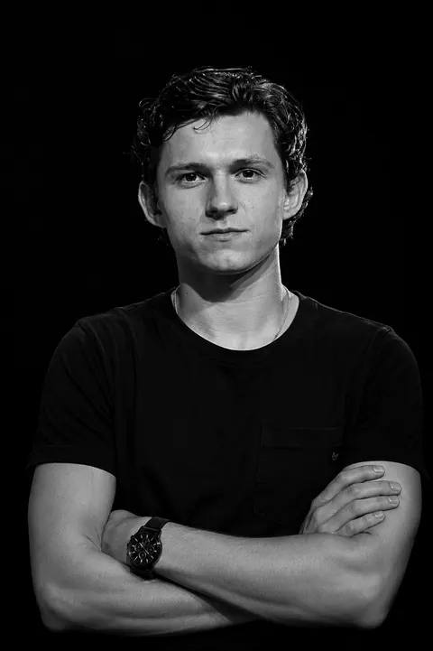 Tom Holland — monochrome crossed-arms studio portrait, AI-generated