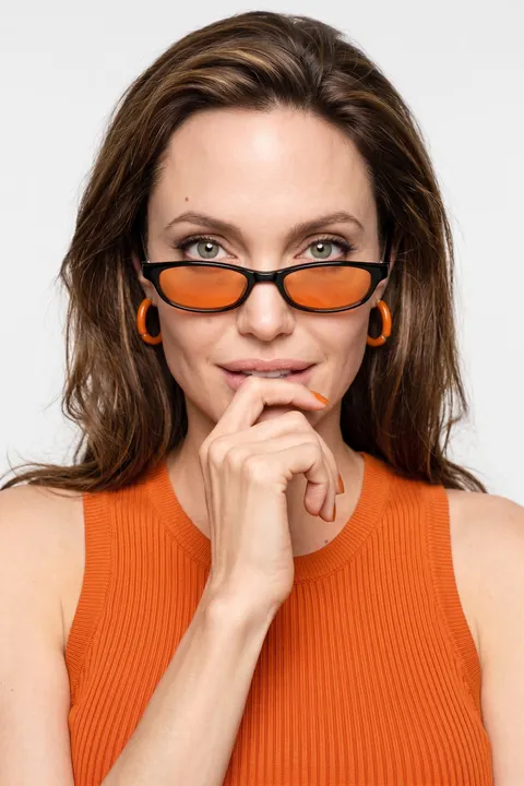 Angelina Jolie — orange-accent high-key portrait, AI-generated