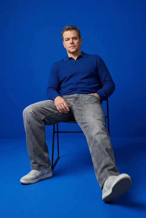 Matt Damon — royal blue streetwear seated portrait, AI-generated